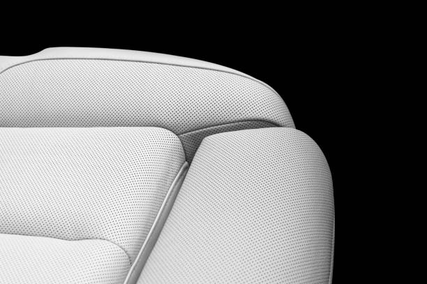 istock White leather interior of a car. Perforated white leather comfortable seats with stitching isolated on black background. Car interior details. Car detailing. Car inside 1139659811