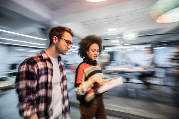 istock Blurred motion of reading reports while walking through the office. 1139661831