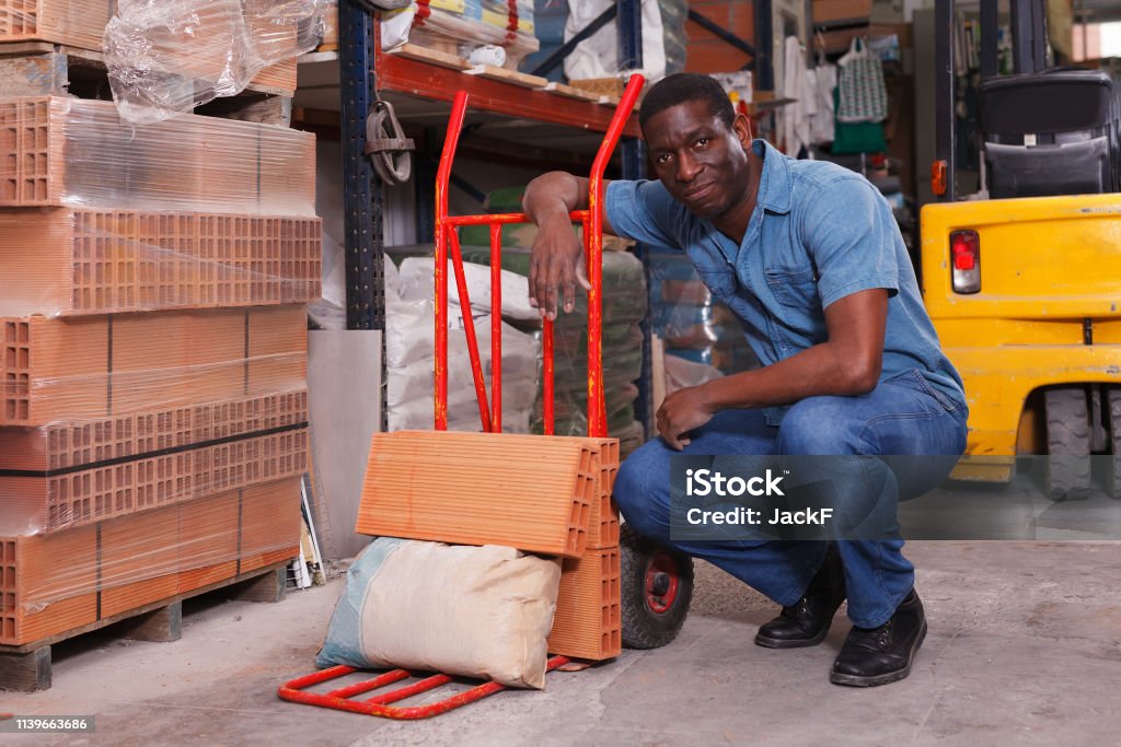 Material Loading Manually Man Loading Building Materials On Cart Stock Photo - Download Image Now ...
