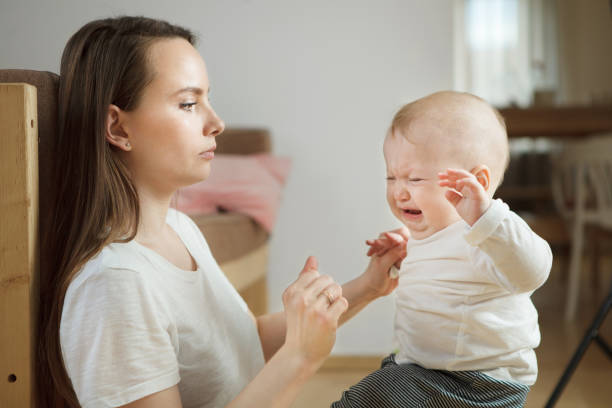 istock Little boy started crying, serious worried mother looking at him. 1139666213