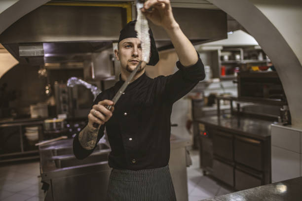 istock Busy chef in fish restaurant 1139666963