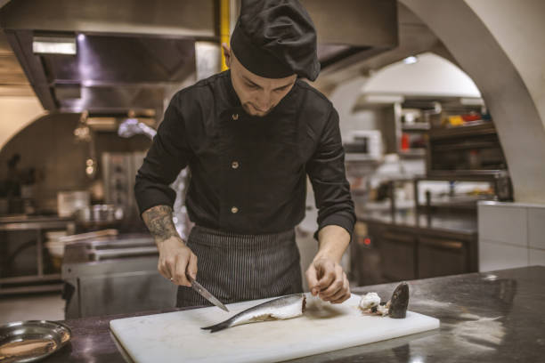 istock Busy chef in fish restaurant 1139667031