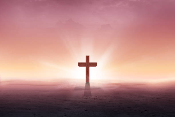 istock Christian cross on the desert with sun rays 1139668867