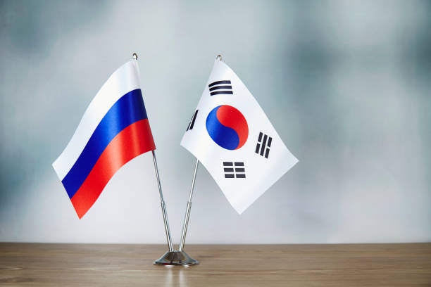 istock Russian and South Korean flag standing on the table 1139669136