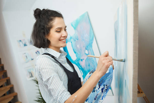 istock Concentrated woman focused on creative art-making process in art therapy 1139670545