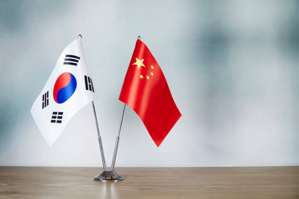 istock Chinese and South Korean flag standing on the table 1139670560