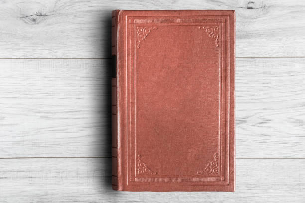 istock Book on wooden background 1139672195