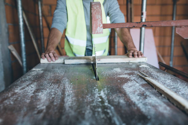istock Construction Worker is Working on Electric Saw and is Cutting Wooden Planks 1139673017