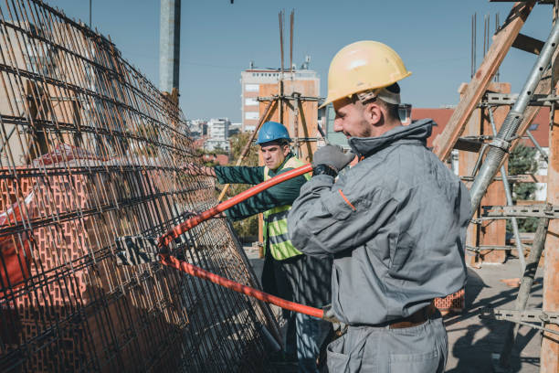istock Construction Workers with Scissors for Metal are Working at the Rooftop 1139673160