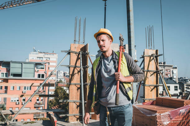 istock Construction Worker with Scissors for Metal is Working at the Rooftop 1139673198