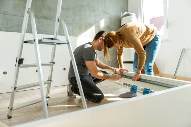istock Young couple assembling the bed in new apartment 1139674457