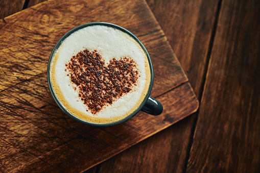 Cappuccino topped with Love Heart Shaped chocolate sprinkles.