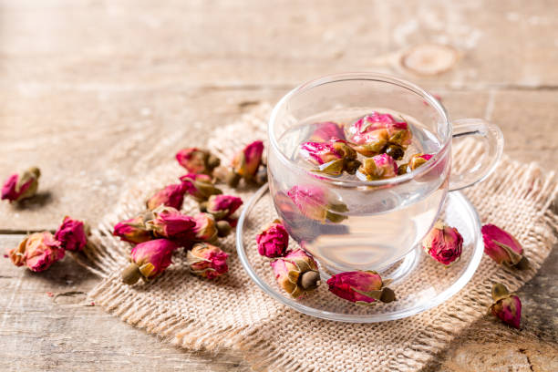 istock Herb tea with rose petals. Dry rose buds, tea cup 1139679222