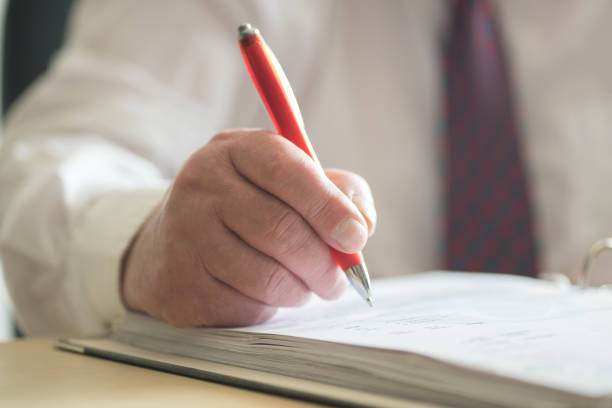 istock A Man with Ballpoint Pen Signs a Document 1139679282