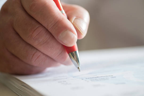 istock A Man with a Ballpoint Pen Signs a Document 1139679332