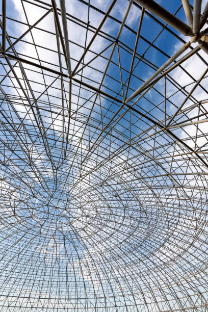 istock Circular steel structure in the blue sky and white clouds background 1139679990