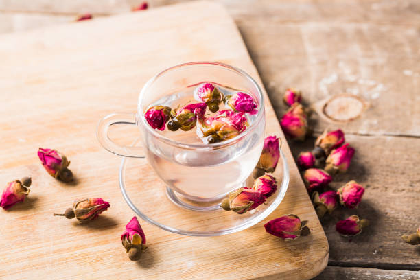 istock Herb tea with rose petals. Dry rose buds, tea cup 1139679991