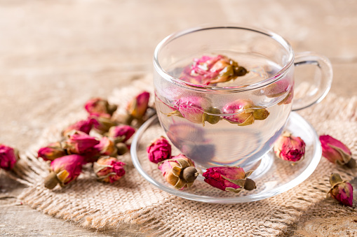 Rose buds with glass cup