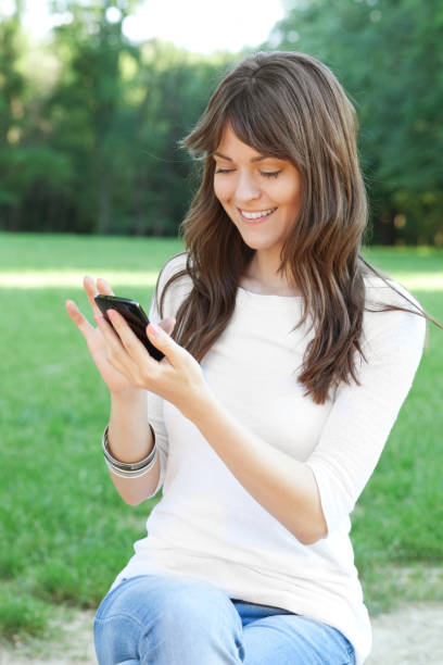 istock Young woman using cell phone 1139680606