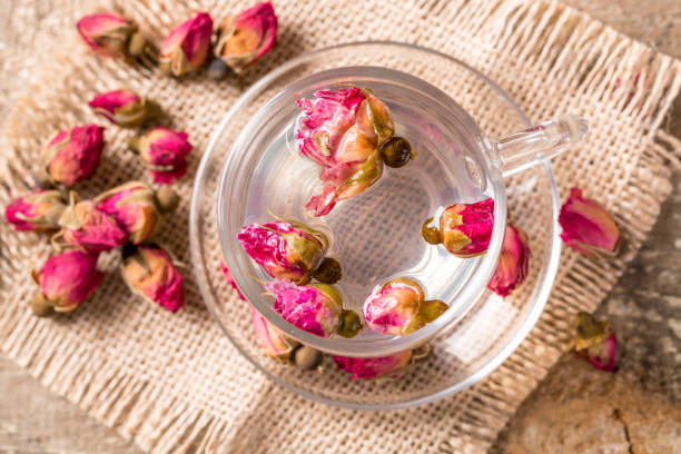 istock Herb tea with rose petals. Dry rose buds, tea cup 1139682364