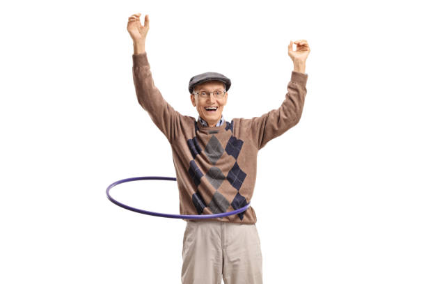 istock Senior man raising hands with a hula hoop 1139682461