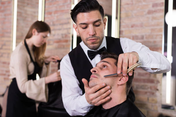 istock Man during beard shaving in barbershop 1139682852