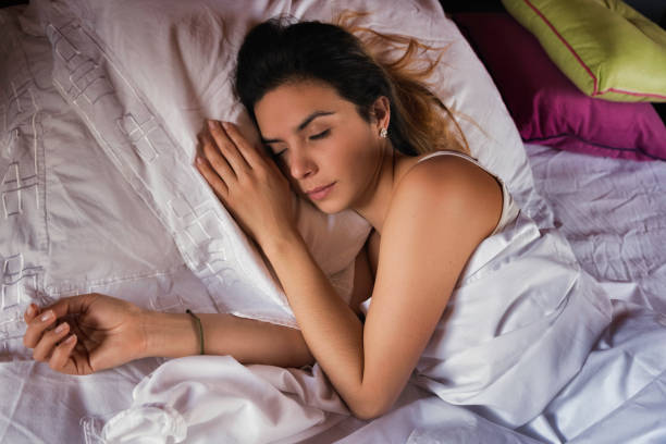 istock Hispanic cute young woman sleeping on bed 1139683315