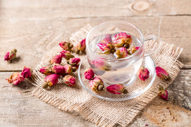 istock Herb tea with rose petals. Dry rose buds, tea cup 1139683502