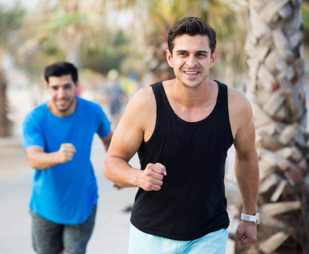 istock Two friends are doing race in time training 1139684421