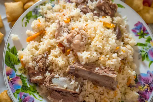 Kyrgyzstan traditional dish Pilaf, pilau is a rice dish with ingredients like meat, vegetables and spices.
