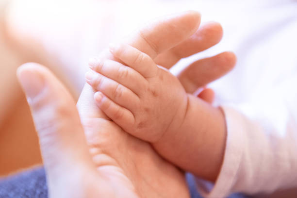 istock Baby hand holding her mother hand 1139684933