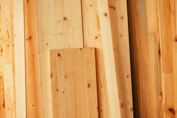 Pine wood floorboard planks in workshop ready to be used for hardwood flooring