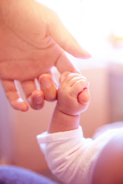 istock Baby hand holding her mother hand 1139685069