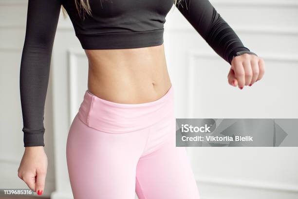 Closeup Athletic Female Body Slim Elegant Waist Of A Stylish Fitness Model  With Perfect Figure Lines