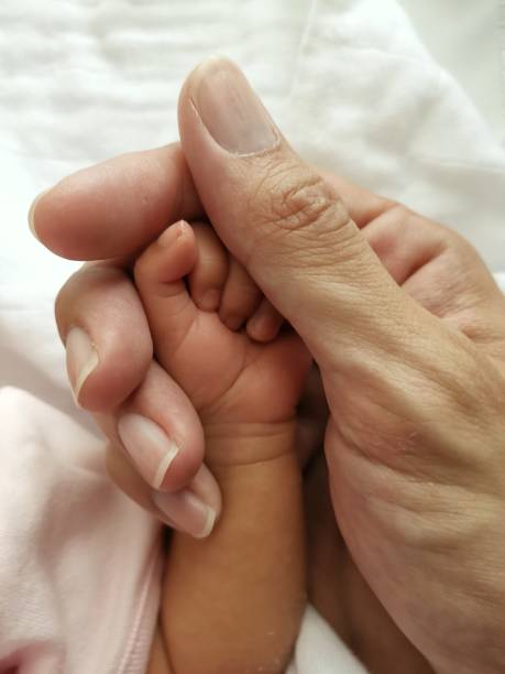 istock Father hand hold baby new born hand 1139686694