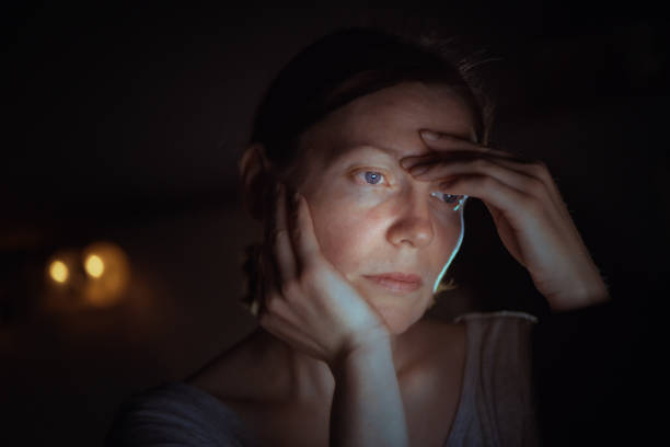 istock Tired woman working overtime on laptop computer 1139687065