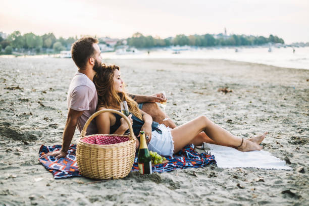 istock Couple on the river drinking wine 1139687250