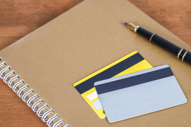 istock Credit card or debit card on working table ,shopping online concept. 1139690038