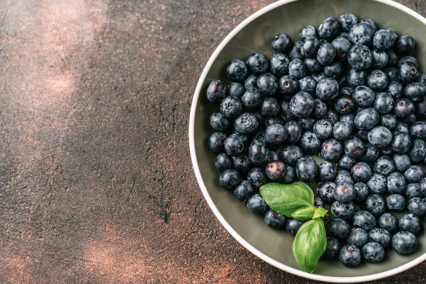 istock Fresh blueberries in a cup on white background 1139691376