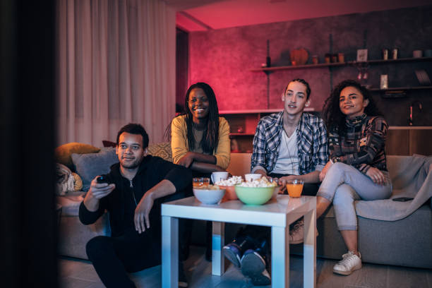 istock Friends watching TV at home 1139692612