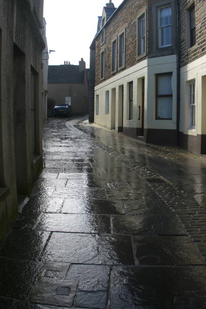 istock Stromness Orkney - main street -wet flagstones 1139692929