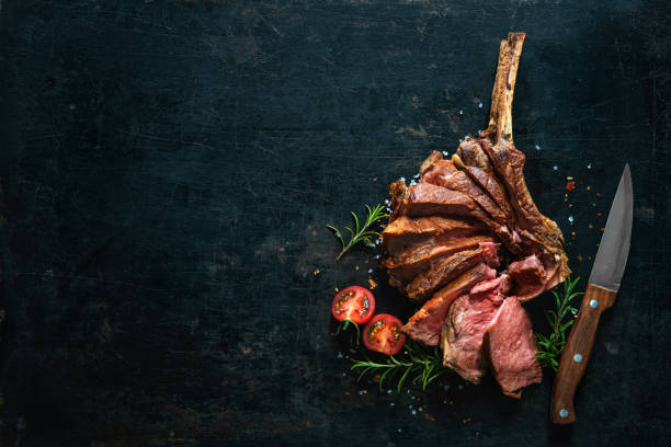 istock Grilled dry aged tomahawk steak sliced as close-up 1139694544