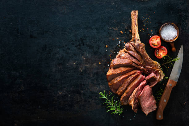 istock Grilled dry aged tomahawk steak sliced as close-up 1139694545
