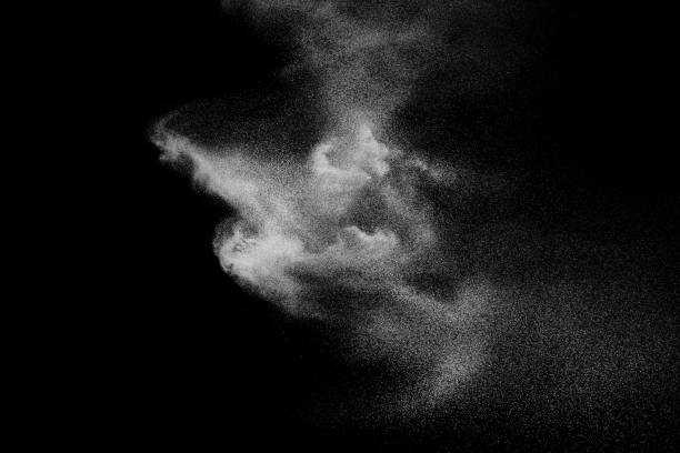 istock Freeze motion of white dust particles on black background. 1139695876