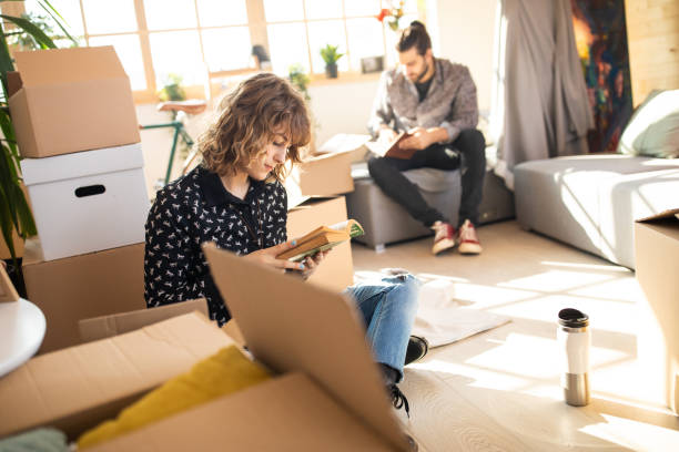 istock Young couple resting after moving house 1139702654