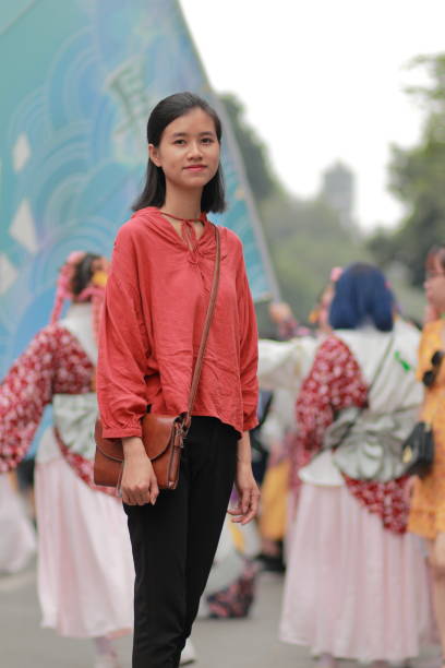 istock young woman in the crowd 1139705000