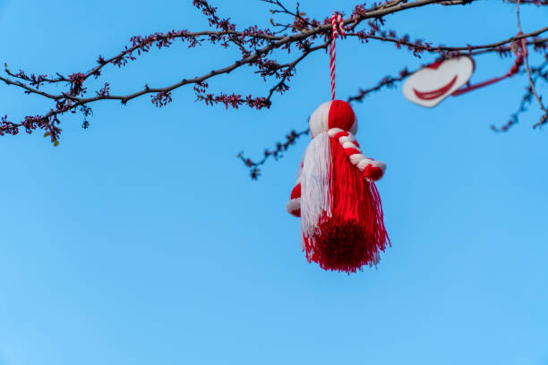 istock Big Martenitsa on a tree with blue sky in the background 1139705703