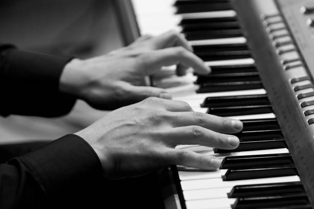 istock Hands of a musician playing a synthesizer 1139707601