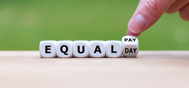 Symbol for the equal pay day. Dice form the expression 
