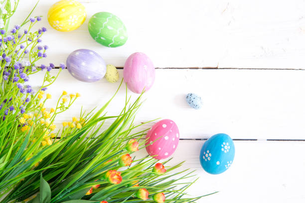 istock Easter eggs and branch with flowers on wooden 1139707992